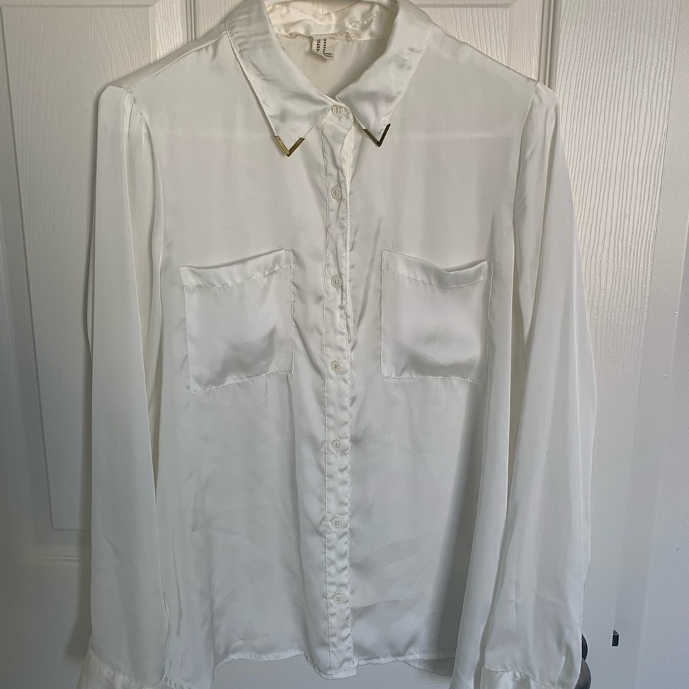 Forever 21 very short white silky type button down blouse.